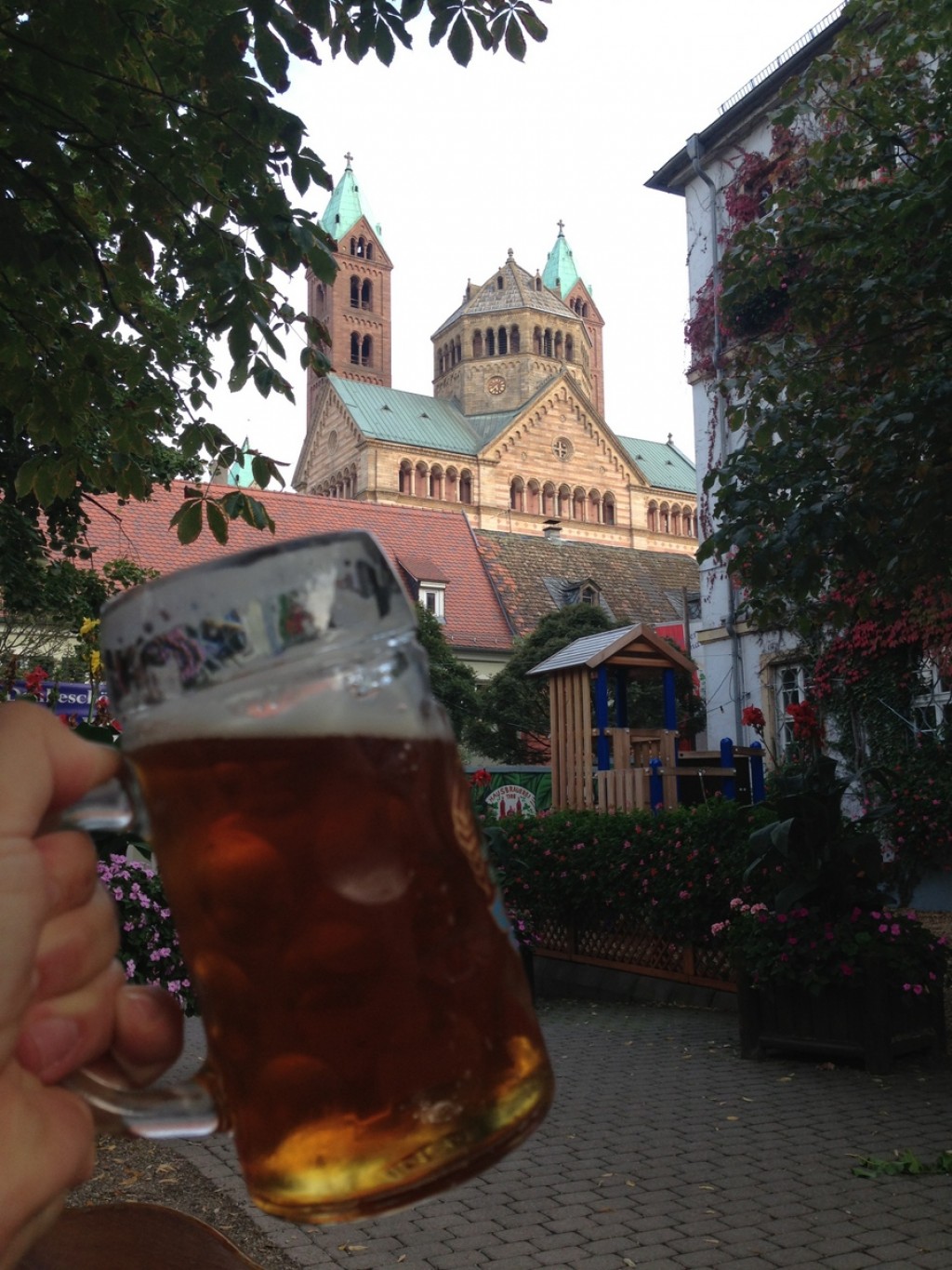 Happiness is a beer garden with a perfect view of an enclosed playground.  Oh, and an amazing cathedral in the background for good measure.